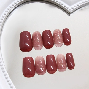 Gradient cherry red and pink press-on nails with golden glitter in short square shape
