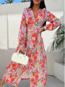 Detail of V-neck floral maxi dress featuring high slit and elastic waist design