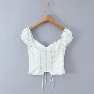 Close-up of French vintage floral puff sleeve top with adjustable drawstring detail