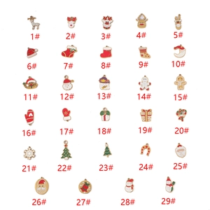 29 assorted Christmas enamel charms in 18K gold plating including reindeer and snowmen