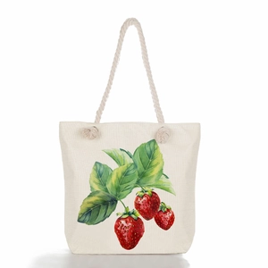 Detailed texture of canvas tote bag with woven rope handles and strawberry print