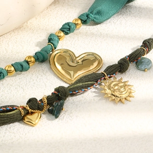 Vintage 18K gold plated stainless steel sun and heart pendant necklace with green fabric cord