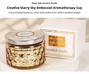 Detail of Velvet Rose scented candle in golden star embossed glass with premium white box
