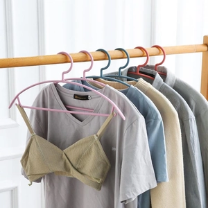 Non-slip plastic hangers with wide shoulders in various colors for home clothing organization