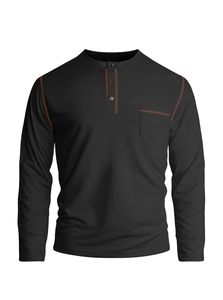 Detailed view of black men's Henley shirt with orange contrast stitching and chest pocket