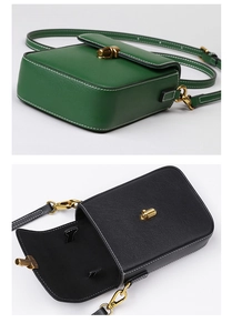 Detail view of leather crossbody bags with white contrast stitching and gold twist locks