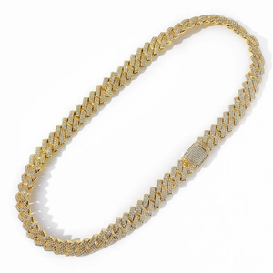 Macro shot of 14mm gold hip hop Cuban link chain featuring iced-out zircon pave settings