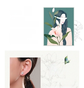 Detail of S925 silver teardrop earrings with halo pavé crystals shown on model