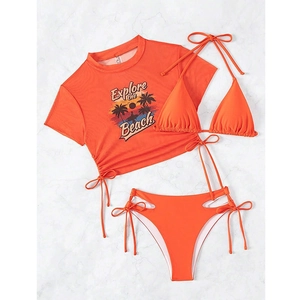 Flat lay of orange three-piece bikini set with retro sunset print and mesh cover-up top