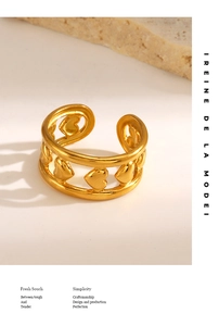 Detailed view of a gold-plated heart relief open ring with polished textured surface
