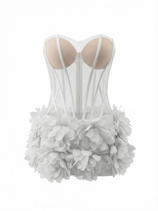 Detail of white mesh corset top with 3D floral petals and boning structure