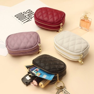 Quilted leather double zipper coin purse with heart charms in black, red, white, and purple