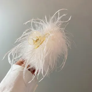 Elegant white ostrich feather claw clip for women, fluffy hair accessory for updo styles