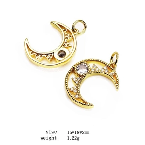 Detail of gold moon pendant set with micro zircons, size 15x18mm, weight 1.22g on white