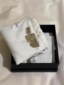 Silver geometric fringe earrings with luxury white drawstring pouch and black gift box