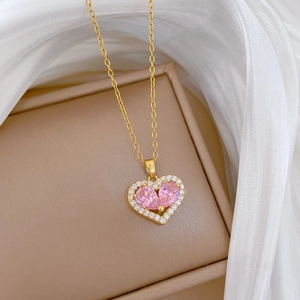 Elegant gold titanium necklace with hollow pink crystal heart and sparkling micro-pave crystals