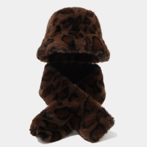 Detail showing soft leopard print faux fur texture on bucket hat and scarf set