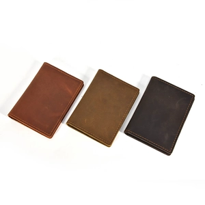 Handmade crazy horse leather coin purses in brown and black with vintage stitching details