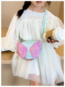 Detail of girls' sequin cross-body bag with blue and pink wings and adjustable strap