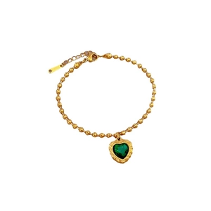 Vintage gold stainless steel beaded bracelet with a heart green gemstone pendant