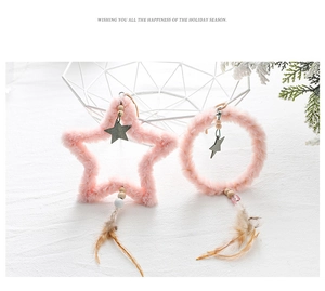 Pink plush star and round Christmas tree ornaments with feathers and wooden beads