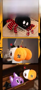 Detail of Halloween plush set featuring spider, pumpkin, and bat dolls with soft texture
