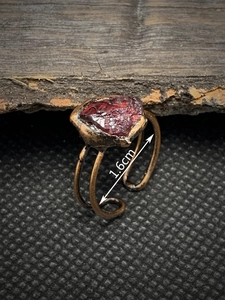 Detail view of the vintage open ring showing 1.6cm band height and raw red gemstone