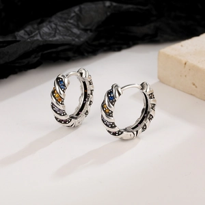 Vintage silver earrings with colorful zircon stones and spiral texture on stone base
