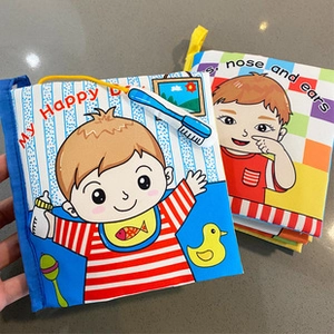 Detail of soft fabric baby books with colorful covers and tactile textures for early learning