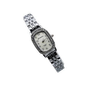 Elegant women's quartz watch with rhinestones, silver metal strap and white oval dial