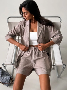Close-up of casual notch lapel linen set with functional drawstring and side pockets