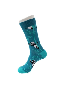 Detail of teal crew sock featuring a panda and bamboo pattern on a foot model