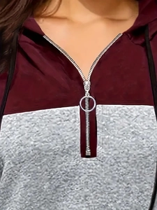 Women's burgundy and grey color-block hoodie with circular zip pullover detail