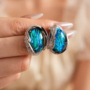 Vintage silver earrings with oval blue resin stone and shimmering rhinestones
