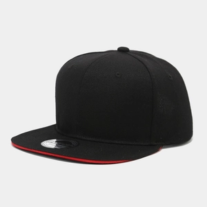 Detail of black hip-hop cap featuring a red sandwich brim and twill cotton fabric texture