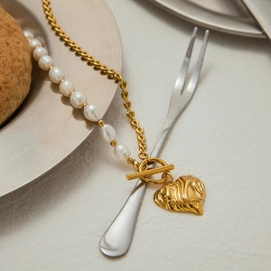 Natural freshwater pearl and 18K gold plated heart pendant necklace on a linen setting
