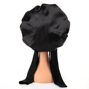 Black satin sleep bonnet with adjustable long ties and bow for hair protection