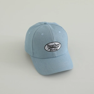 Detail view of Bestboy Holle embroidery on light blue denim baseball cap for boys
