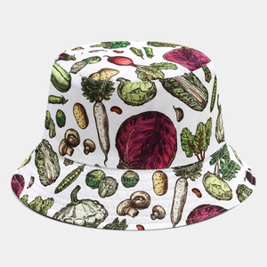 Detail of white cotton bucket hat with colorful hand-painted vegetable print texture