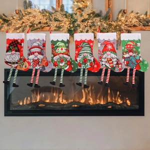 Set of 6 Christmas stockings with cartoon gnome designs hanging on fireplace mantel