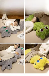 Detailed views of long plush cat pillows used as headrests and sleeping cushions in bed