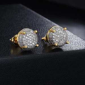 Macro shot of gold hip-hop stud earrings with micro-pave white cubic zirconia stones