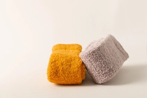 Detail of coral fleece knee high socks in ginger and grey with soft warm texture