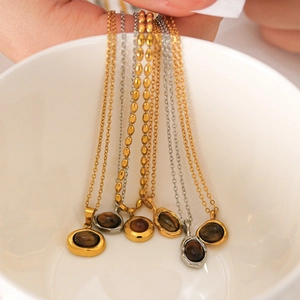 Retro stainless steel necklaces with oval tiger eye stone pendants in gold and silver