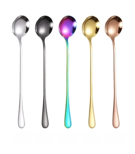 Close-up of five long-handle stainless steel coffee spoons with polished mirror finish