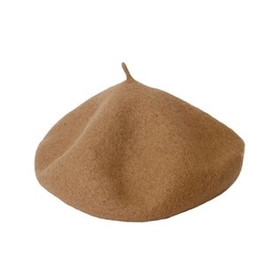 Classic camel wool beret hat for women with minimalist winter fashion style on white background