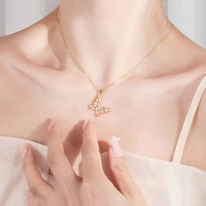 Elegant gold butterfly pendant necklace with shimmering zircon stones on a snake chain