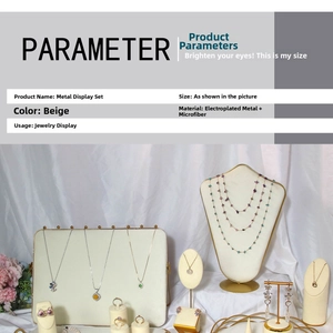 Detailed set of beige microfiber jewelry displays with golden plated metal frames