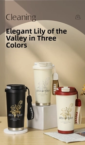 Detailed view of three stainless steel coffee mugs with floral prints and woven straps