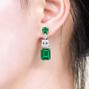Emerald cut green zircon drop earrings with square clear stones in silver finish